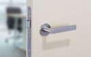 Flat_front_stainless_steel-lever-on-GREEN-PAINT