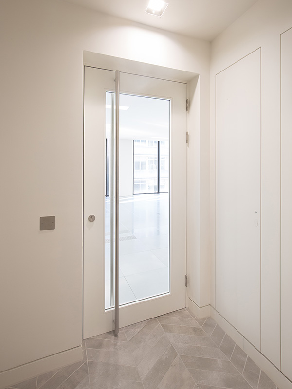 Shadbolt RAL 9016 glazed fire doors at 55 Wells Street