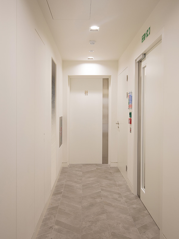 Shadbolt RAL 9016 WC entrance door at 55 Wells Street